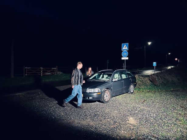 Night shoot by a parked car